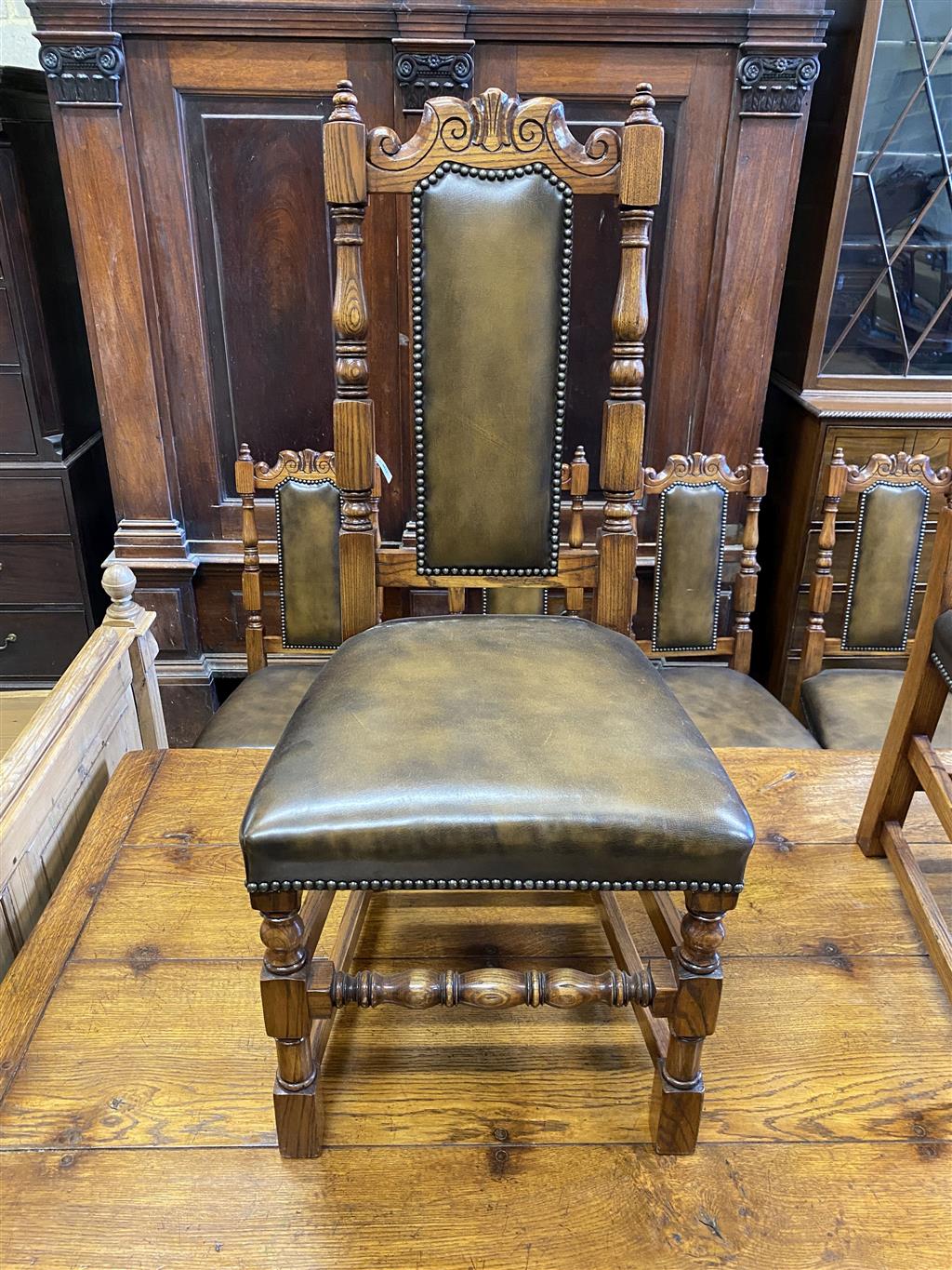 A set of ten 18th century style oak brown leather dining chairs (two with arms)